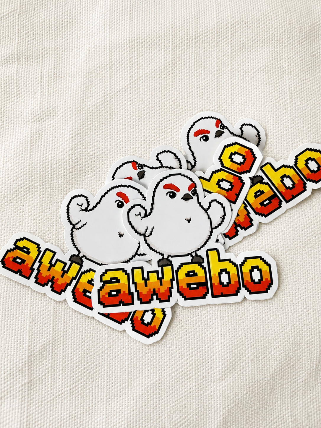 Stickers de Awebo sobre una tela